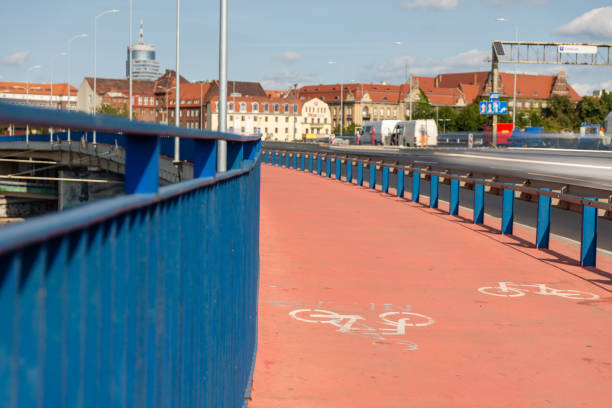 istock Bicycle path next to the two-lane road 1189934460