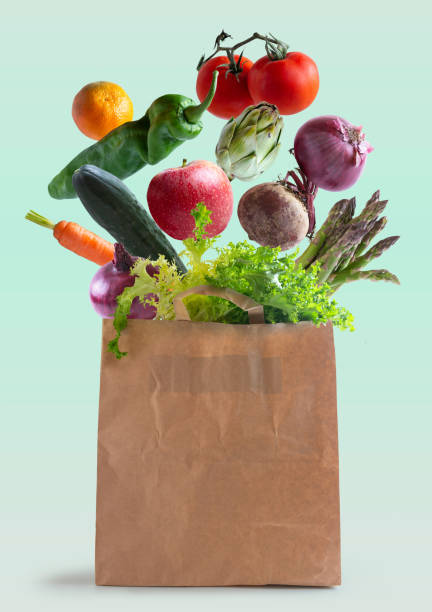 istock Vegetables flying in recycled paper bag 1189935507