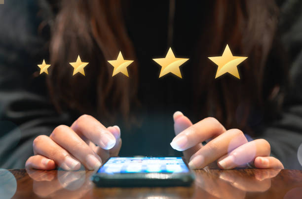 istock Customer using smartphone device to fill out customer satisfaction email survey 1189935998