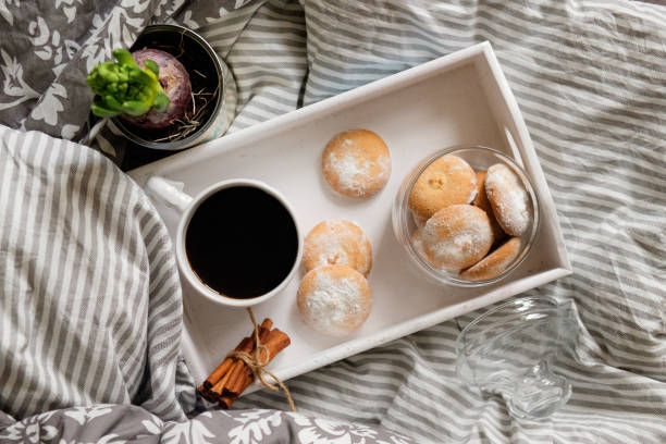 istock breakfast in bed. top view. Coffee with cookies on a tray 1189936845