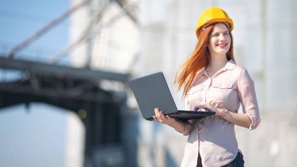 istock Engineers in front of silo talking and making plans 1189936935