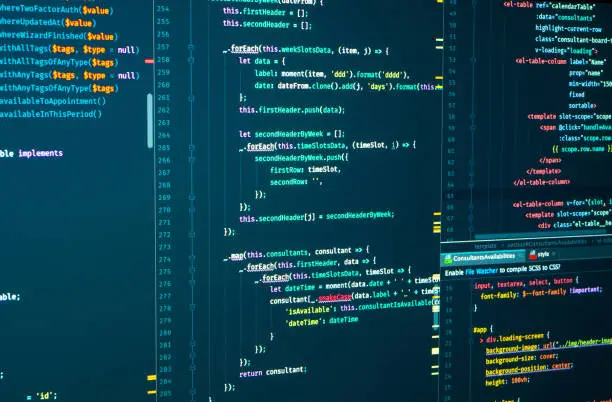 Photo of Javascript source development code. Script language for software development. Digital java code and markuÐ· splitting on the screen