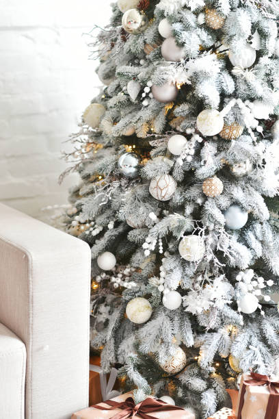 istock White Christmas decoration with balls on fir branches with blurred background 1189940338