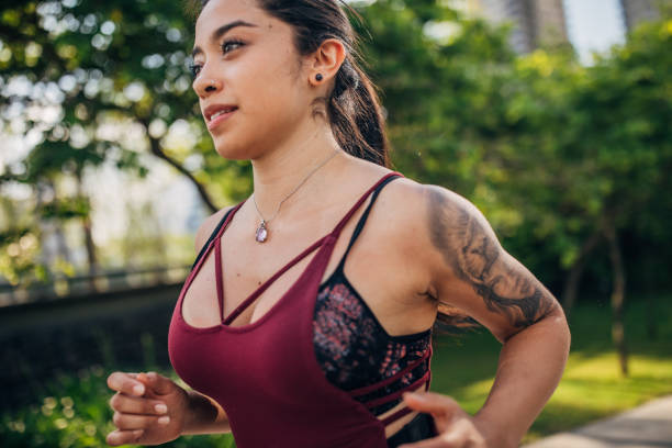 istock Fit lady jogging in city park 1189943428