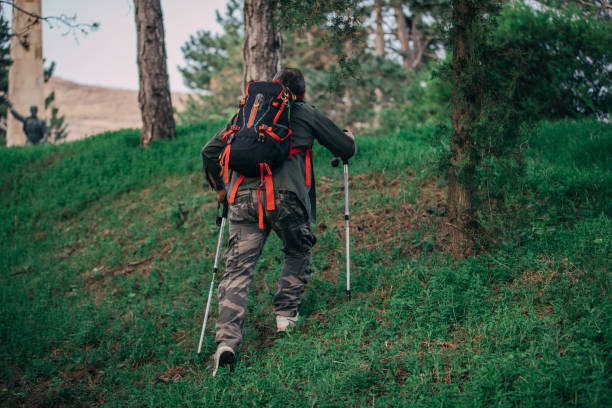 istock Hiking an older man on a mountain for recreation 1189945659