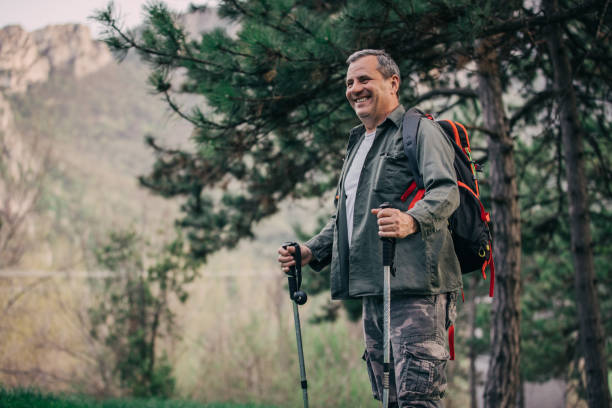 istock Hiking an older man on a mountain for recreation 1189945715