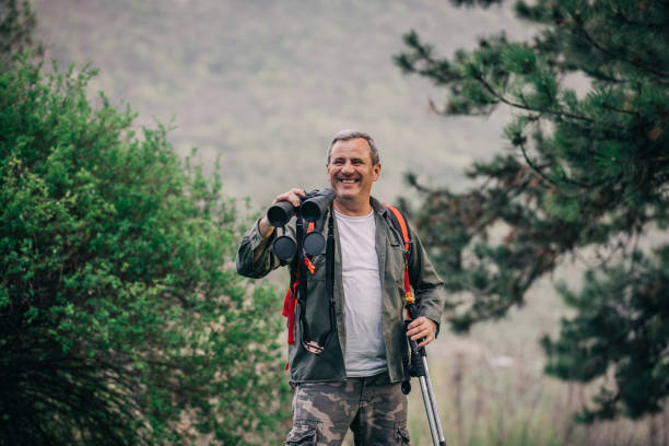 istock Hiking an older man on the mountain for binoculars recreation 1189945742