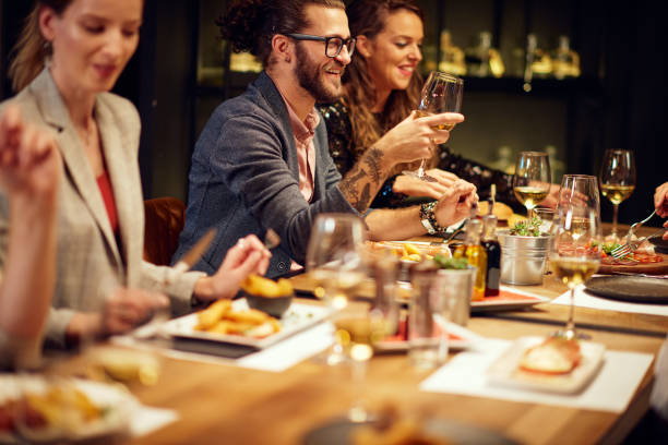 istock Friends having dinner at retaurant. 1189946320