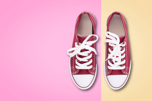 istock Red sneakers top view isolated on white background 1189947481