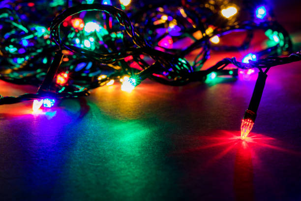 istock Christmas garland lights on darck background 1189948255