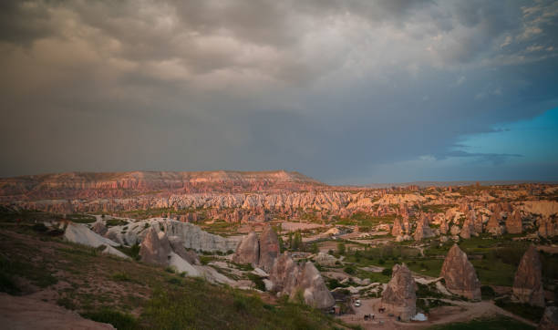 Sunset panoramic view to Goreme city and valleys, Cappadocia, Turkey Sunset panoramic view to Goreme city and Red, Rose and meskendir valleys Cappadocia, Turkey niğde city stock pictures, royalty-free photos & images