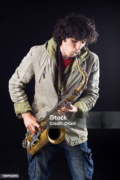 Jazz Saxophone Player On A Black Background Stock Photo - Download Image Now - Saxophonist, Adult, Adults Only