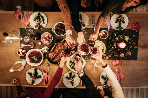 Overhead view of friends eating traditional christmas meal