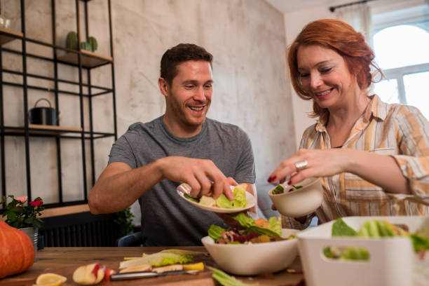 istock Happy vegans composting their organic garbage 1189959900