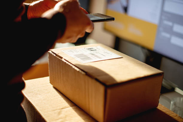 istock Delivery service, scanning a shipping label 1189961439