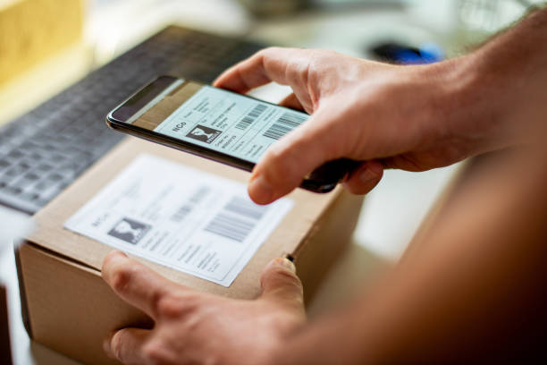 istock Delivery service, scanning a shipping label 1189961496