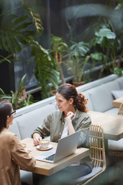 istock Two Contemporary Women at Cafe Terrace 1189962685