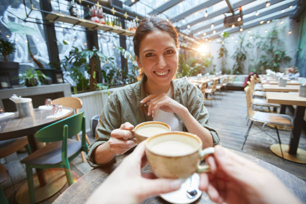 istock Woman Enjoying Coffee with Friend 1189963995