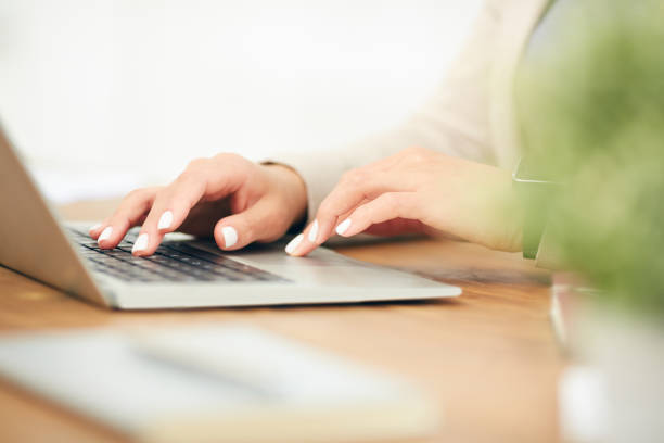 istock Businesswoman Using Laptop Close Up 1189964369