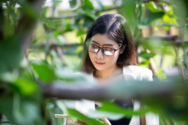 istock Female Researcher Examining Plants 1189966601