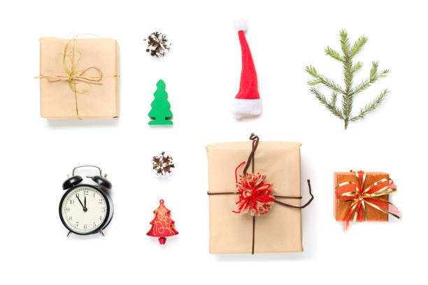 istock Christmas mockup composition. Top view and flat lay. Christmas red Santa hat, vintage clock, fire tree branch, cone, decorations and Christmas gifts on white background. 1189968763