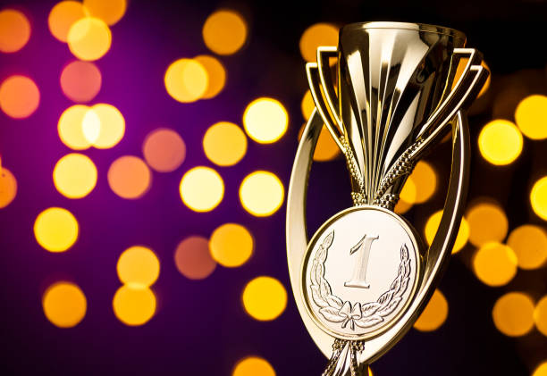 istock Championship winners award with a gold trophy 1189972602