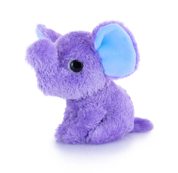 istock Elephant plushie doll isolated on white background with shadow reflection. Plush stuffed puppet on white backdrop. Purple or violet fluffy elephant toy for children. Cute furry animal plaything. 1189974419