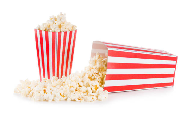 istock Popcorn spilled from a square box isolated on white background 1189975341
