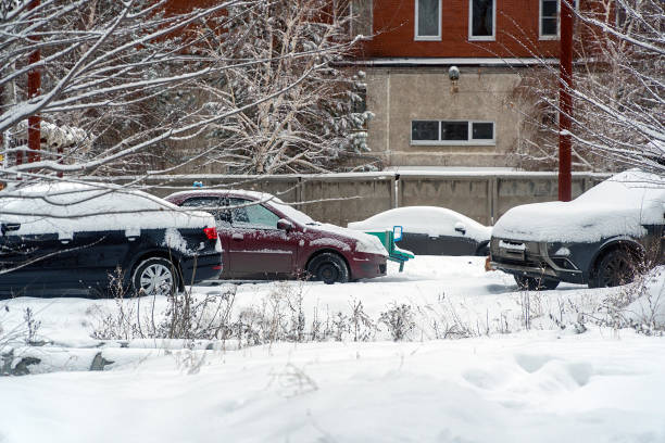 istock Cars under snow in Parking lot 1189976197