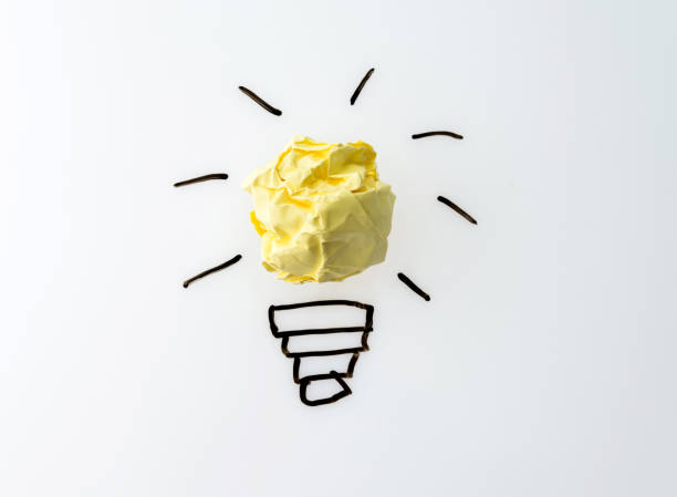 istock Yellow crumpled paper light bulb 1189976344