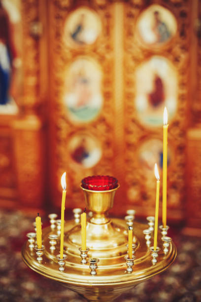 istock The candle flame in orthodox church, selective focus, closeup 1189976527