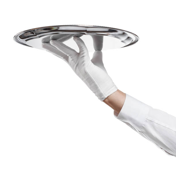 istock Waiter hand holding silver tray on white 1189976610