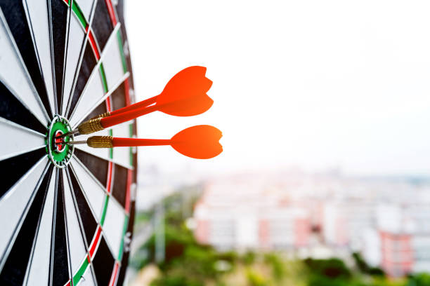 istock Dart board with three darts outdoors 1189976622