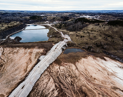Aerial drone view of an abandoned gypsum quarry.