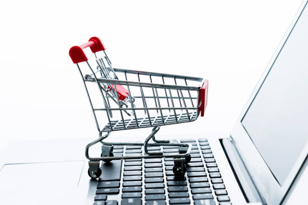 istock Shopping cart on laptop keyboard 1189977794