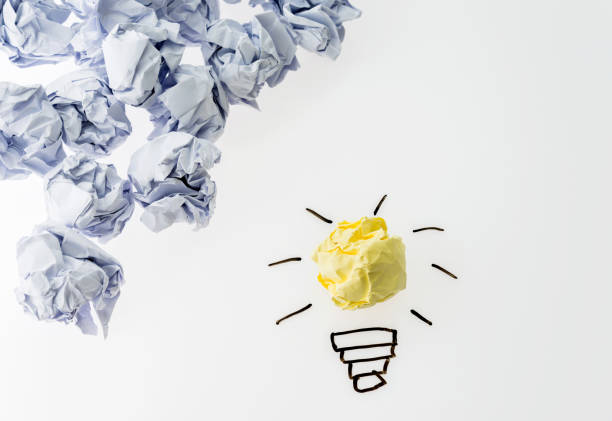 istock Yellow crumpled paper light bulb stand out 1189977909