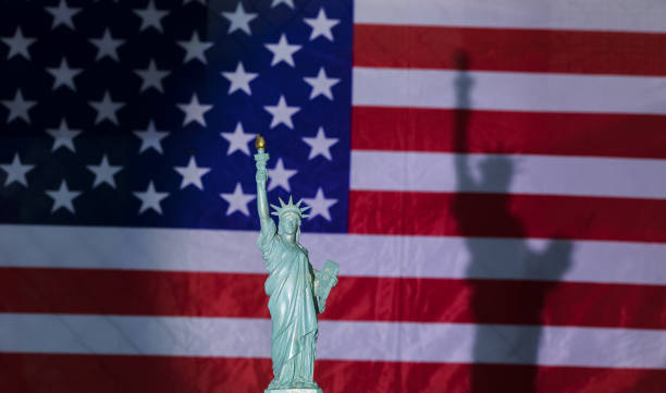 istock statue of Liberty,USA flag 1189978372