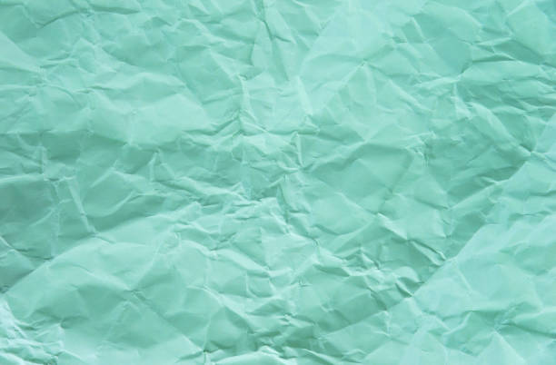 Texture of green crumpled paper.
