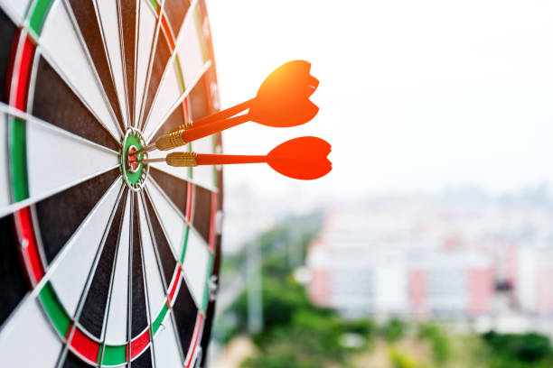 istock Dart board with three darts outdoors 1189979098