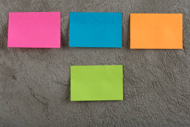 istock Many colorful sticky note on grey cement background. Copy space 1189981200