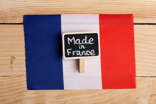 quality concept - French flag and blackboard with Text Made in France