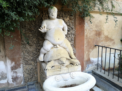 The Bacchus Fountain, one of the Boboli park's most singular fountains. It depicts Pietro Barbino - the court jester of duke Cosimo I - as the Roman god of wine.\nFlorence, Tuscany