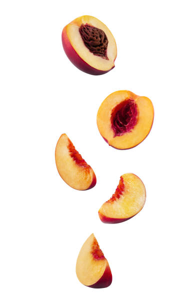 istock Set of smooth-skinned nectarines with kernels and without them isolated on white background with copy space for text or images. Side view. Close-up 1189984404