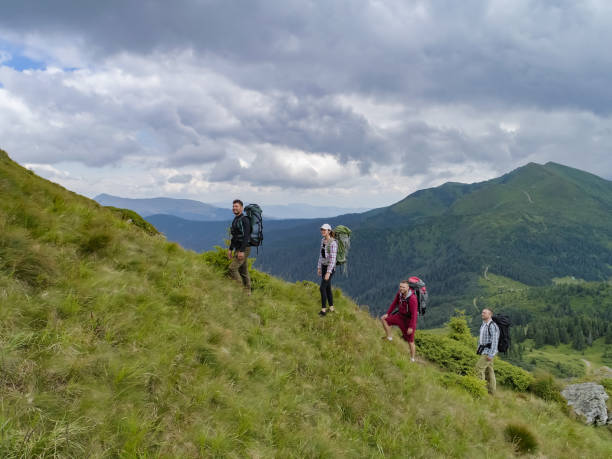 istock The four people walking on the mountain 1189984851