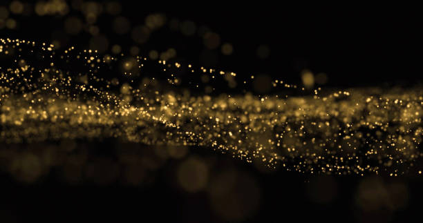 istock Light glitter wave, golden dust splash and glittering particles glow flow. Gold bokeh light overlay on black background 1189986711