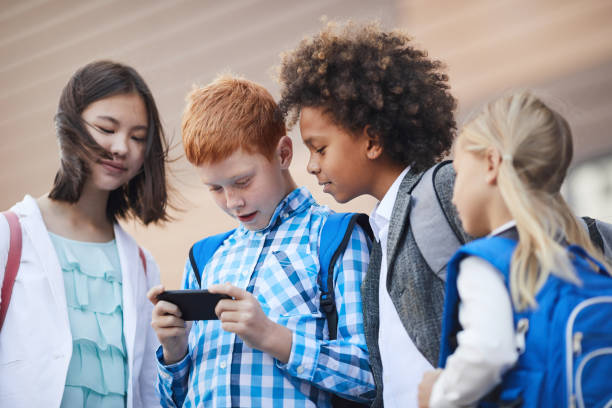 istock Children playing in mobile phone 1189986908