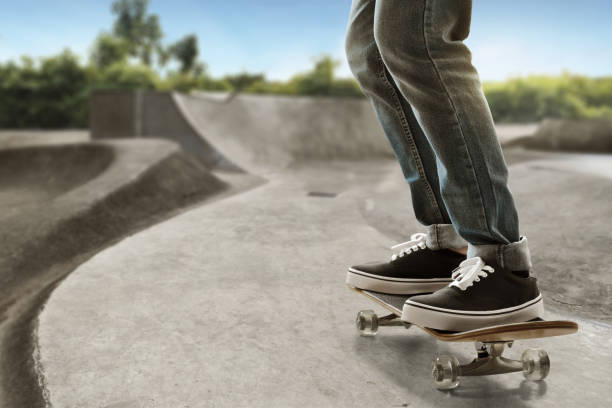 istock Skateboarder skateboarding at skate park 1189986945