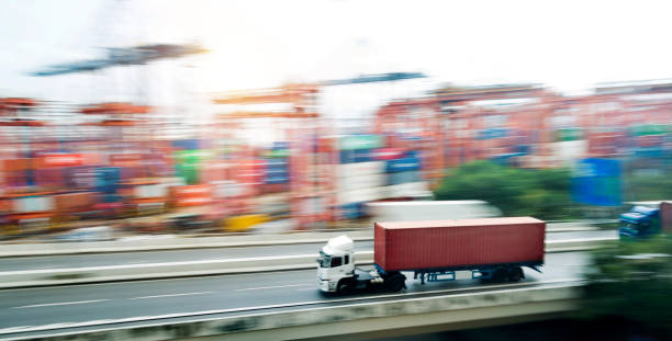 istock Red truck leaving the harbor 1189986986