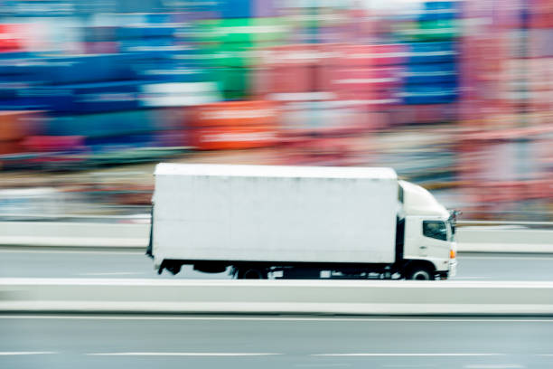 White truck leaving the harbor.