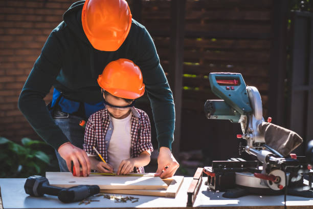 istock The father teaching his little son to use tools 1189988078